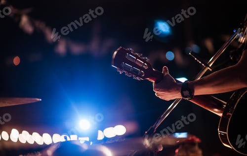Preview: The musicians were playing rock music on stage, there was an audience full of people watching