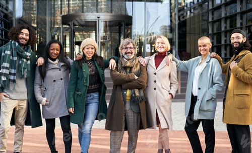 Preview: Portrait of a group of co-workers outdoors a corporate office area.