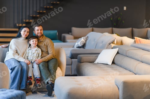 Preview: Family smiling choosing new couch in furniture store