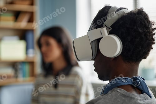 Preview: Black Teenage Boy Using Virtual Reality Headset during Counseling Session
