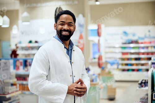 Preview: Smiling Pharmacist in White Coat in a Modern Pharmacy Environment