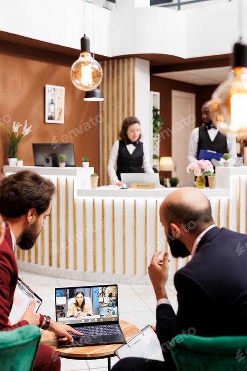 Preview: Businessmen talking on videocall online