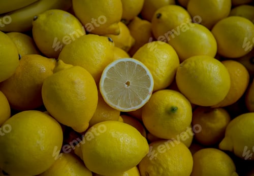 Preview: Fresh Yellow Lemons and Citrus Slice Close-up