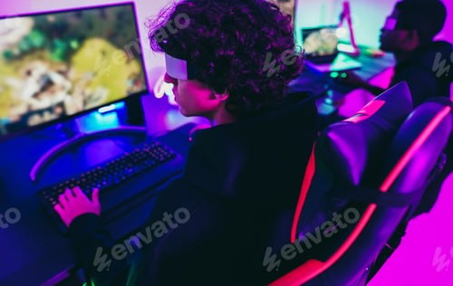 Preview: Young gamers playing at e-sports competition using vr headset - New technology game trends