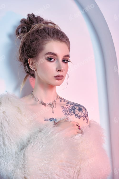 Preview: Woman wearing a white fur coat and sporting a messy bun poses for a photo shoot. Background
