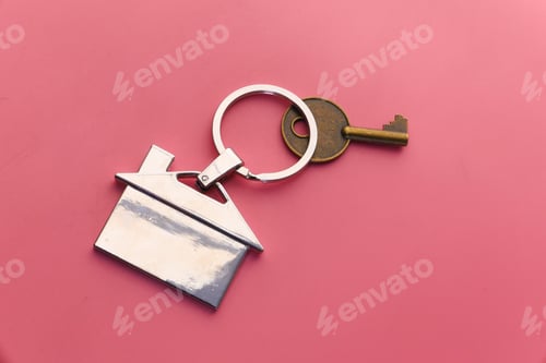 Preview: House and keys on color background, close up