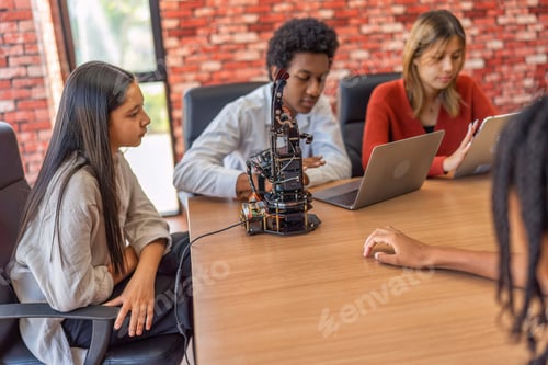 Preview: Teenager children learning with new innovation robotic hand interface hand control in classroom