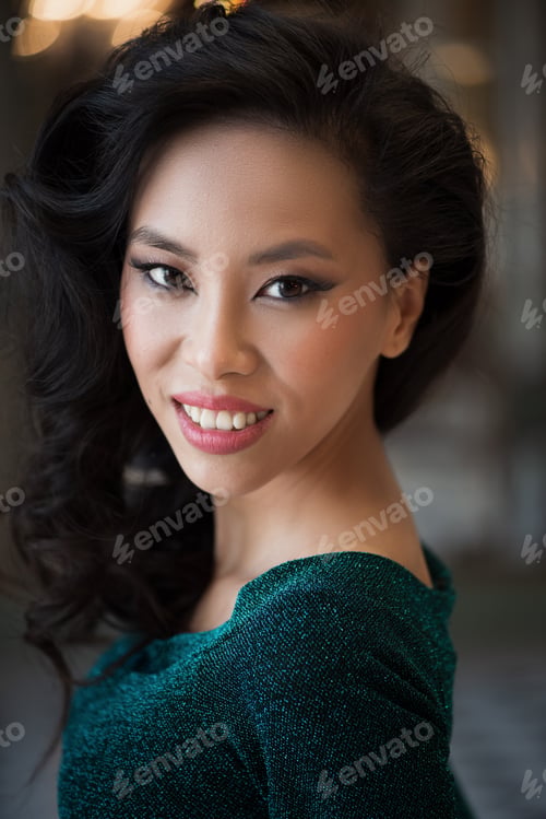 Preview: Portrait Of Beautiful Asian Woman In Green Dress With Evening Make-Up