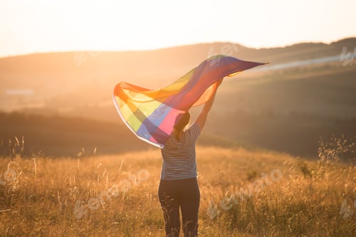 Preview: Young woman with LGBT flag.