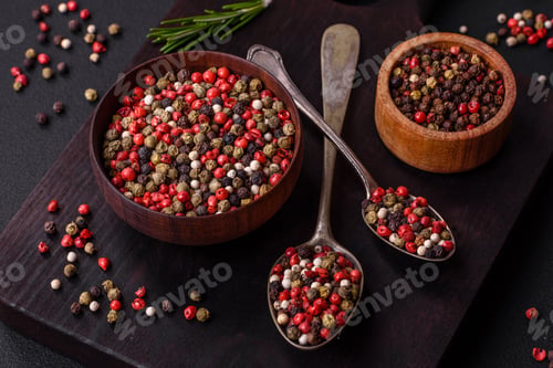 Preview: Spice allspice of different colors pink, white, green not ground in a wooden saucer