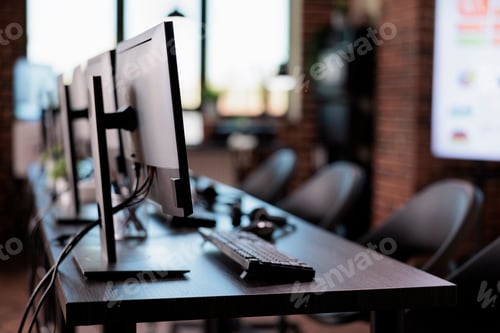 Preview: No people at call center helpdesk with multiple monitors in office