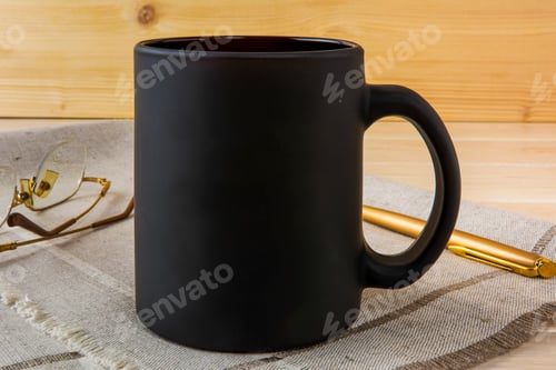 Preview: Black coffee mug mockup with pen and glasses