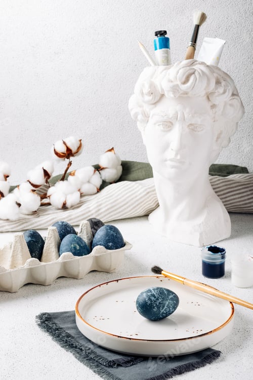 Preview: The process of dyeing Easter eggs with blue and white acrylic paints