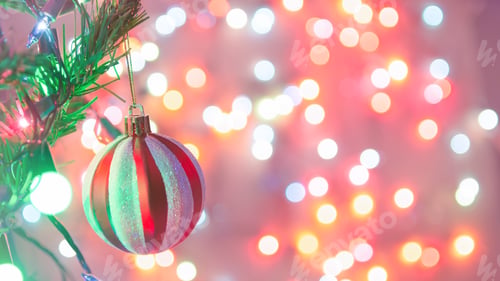 Preview: Christmas decoration. Red balls hanging on pine branches Christmas tree garland and ornaments