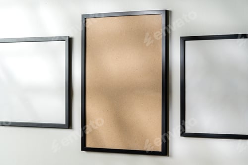 Preview: Blank picture frames on the white wall copy space