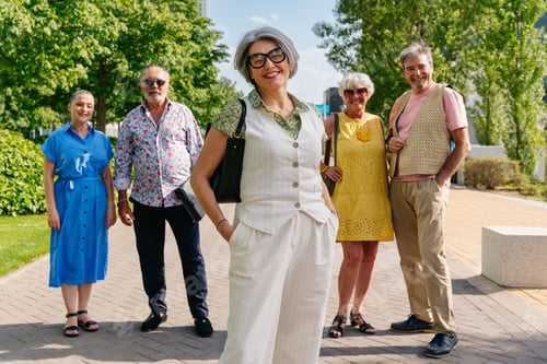 Preview: Group of senior friends meeting outddors in the city and having fun