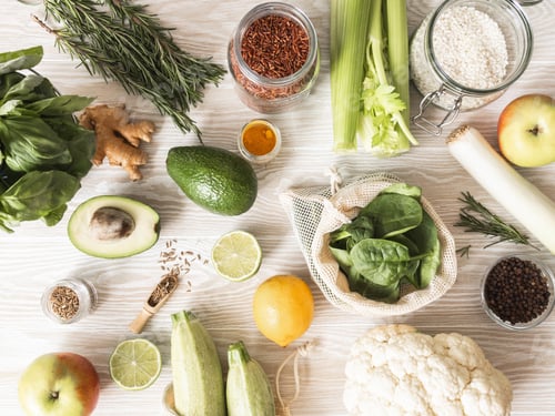Preview: Fresh raw vegetables, fruits, grains and spices on wood light background
