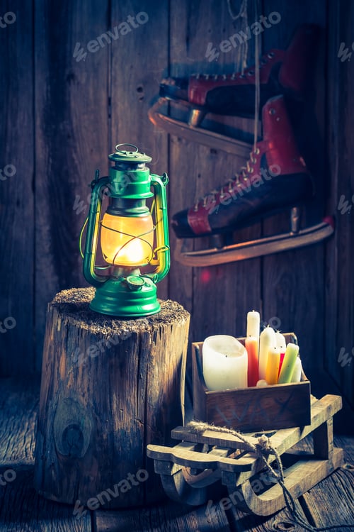 Preview: Vintage winter cottage with snow and oil lamp