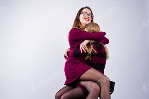 Preview: Portrait of two female friends posing in the studio.