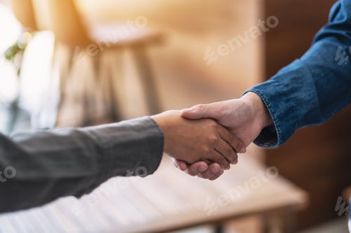 Preview: Closeup image of two people shaking hands