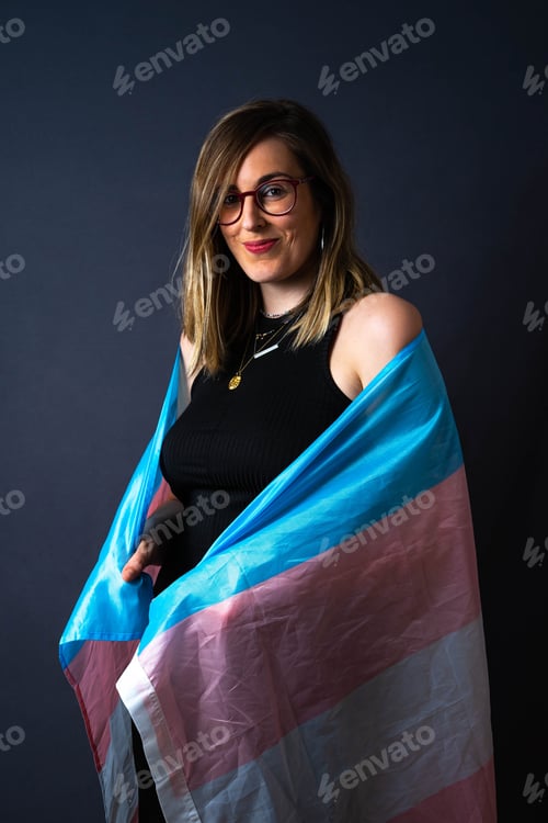 Preview: Isolated Happy Transgender Woman Posing Smiling with LGTB Glag Trans Blue and Pink Portra