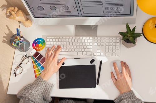 Preview: Graphic designer's workplace with computer in interior of office