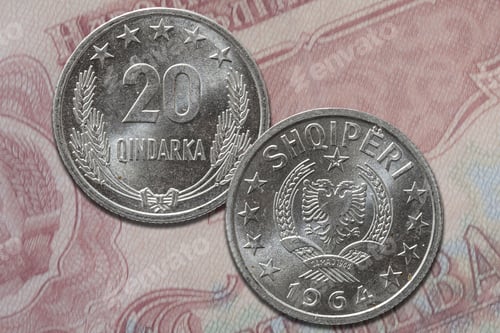 Preview: Closeup shot of Albanian qindarka lek coin from both obverse and reverse sides on a banknote