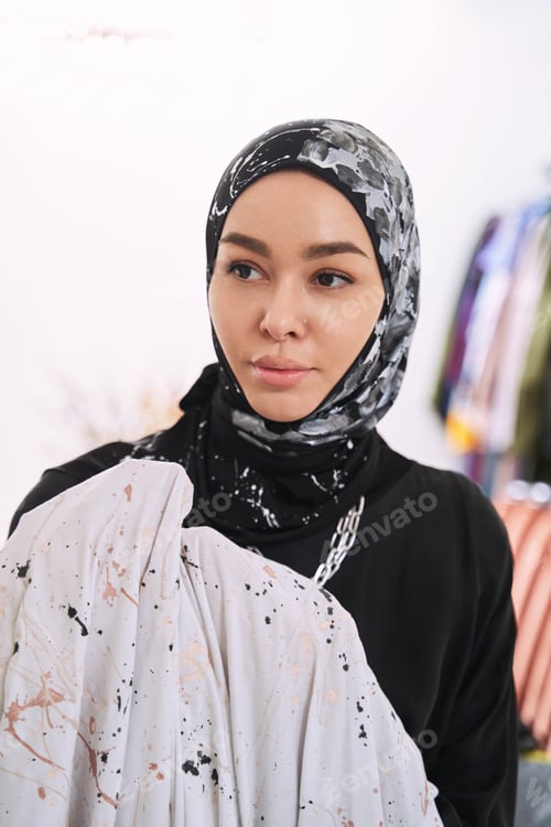 Preview: Woman Posing in Black Attire with Headscarf