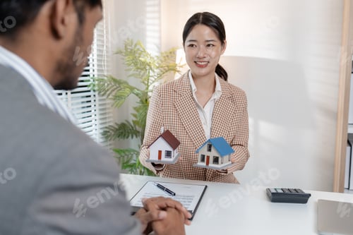 Preview: A real estate agent discusses property contracts with a client