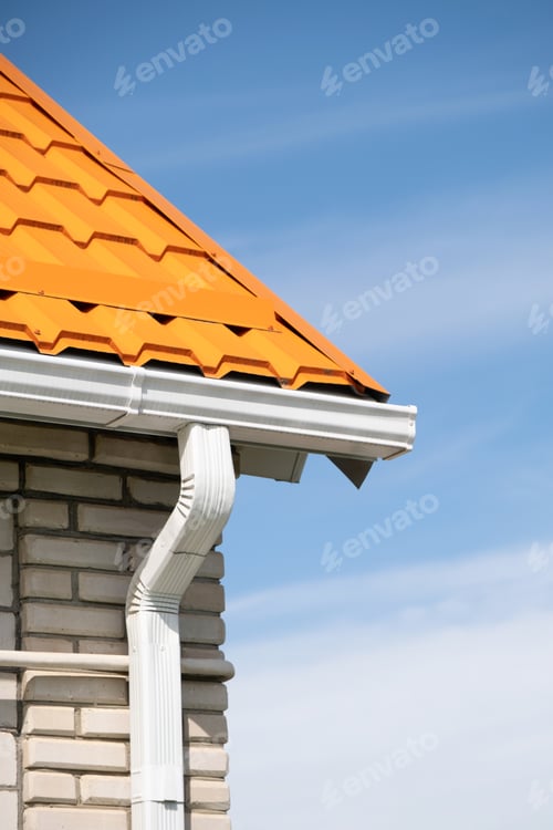 Preview: Rain Gutter Pipeline System on brick house , bright orange metal tile roof