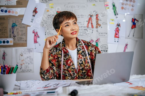 Preview: Young designer female thoughtful about her clothes design