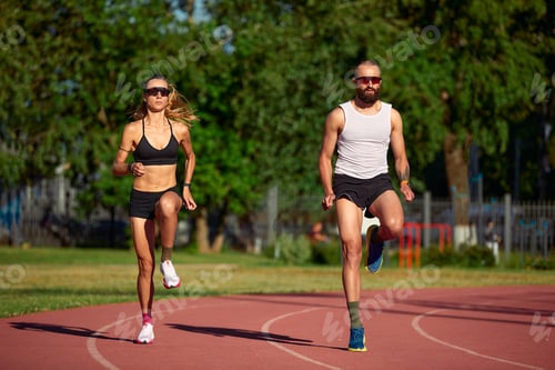 Preview: Diversity training man and woman at the stadium, athletics running