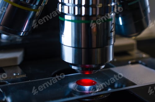 Preview: Examination of blood on a microscopic slide under microscope