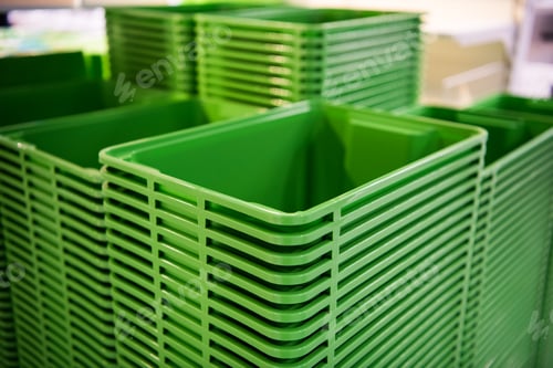 Preview: Green plastic home containers tower at store
