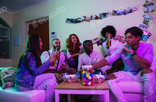 Preview: A group of young people celebrating and making party at home