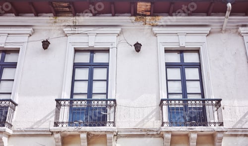Preview: Street view of an old colonial building facade in Quito, color toning applied, Ecuador.