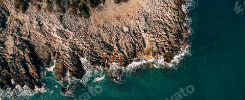 Preview: Dramatic marine background. Rocky coast of the Adriatic Sea. White foamy waves beat against the
