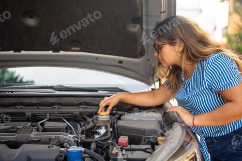 Preview: Woman seeing why her car won't start