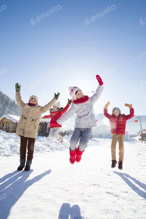 Preview: Happy children jumping in the snow