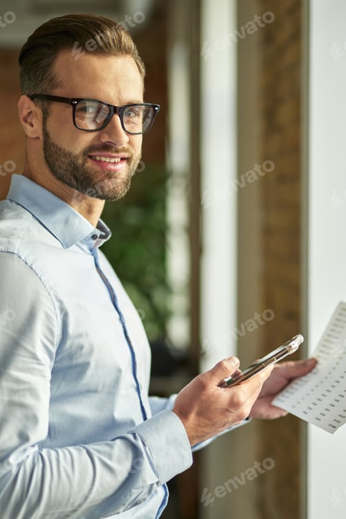 Preview: Attractive person looking contented while being at work