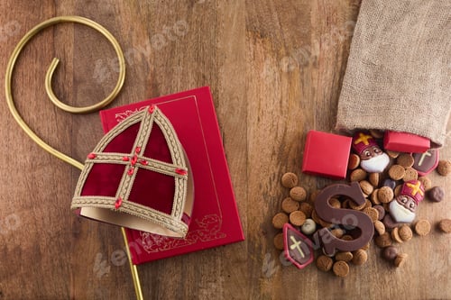 Preview: Dutch holiday Sinterklaas background with mitre or mijter staff and book of Sinterklaas.