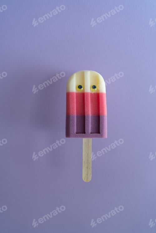Preview: Colored ice cream popsicle on a pastel purple background. Minimal summer concept