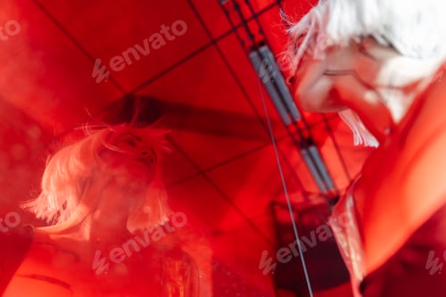 Preview: Stylish blonde on a red background.