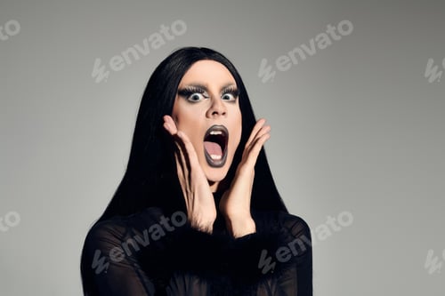 Preview: A striking drag queen presents bold style and dramatic expression in a studio setup
