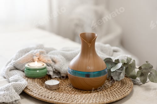 Preview: Spa composition with aroma oil diffuser lamp on a blurred background.