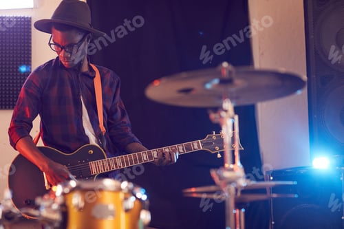 Preview: Musician Plays Electric Guitar in Studio at Night