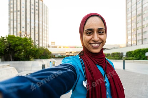Preview: Beautiful arab nurse wearing hijab portrait in the city