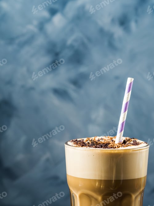Preview: Frappe coffee in tall glass on blue and brown