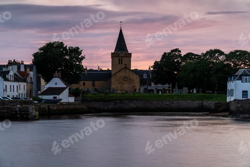 Preview: Dreel Halls church surrounded by buildings in Scotland during sunset