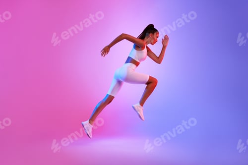 Preview: Determined Sporty Woman Running In Mid-Air Over Neon Background, Side-View